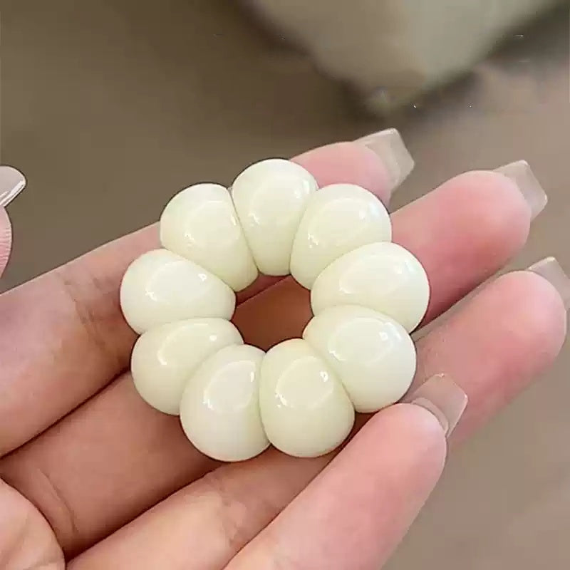 愛らしいミニニンニクとマンゴスチンのハンドヘルドチャーム。複数の色をご用意しています。